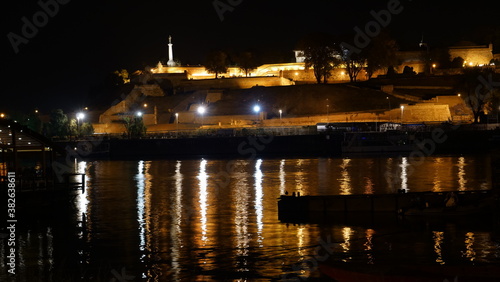Belgrade old Citadel and Fortress Kalemegdan Night Timelapse with Light Reflections on the Sava River Water. The Victory Monument Pobednik  Symbol of Belgrade Downtown  is visible on the Terrace. 