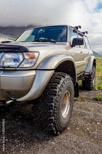 Detail of a SUV 4WD car with extreme tyres in Icelandic landscape