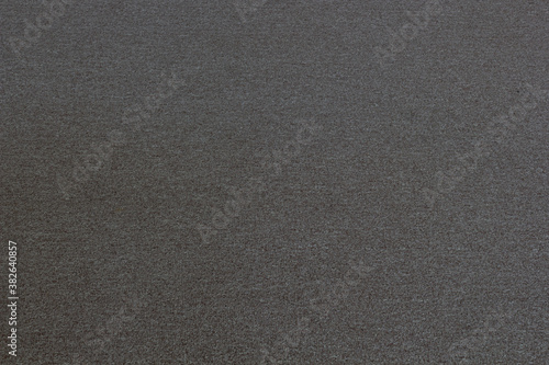 Texture of a woolen gray rug.