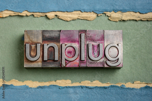 Fotografie unplug  - lifestyle or information overload concept  - word in vintage gritty le