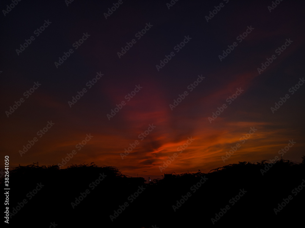 Beautiful sunset with burning edges of the clouds