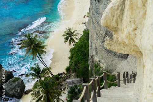 Diamond Beach is a stunning hidden beach located at the bottom of a sheer cliff on the eastern tip of the island of Nusa Penida, bali. photo