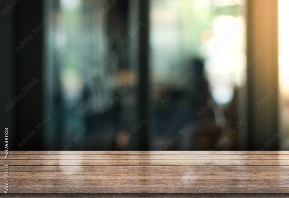 Empty wooden table top with lights bokeh on blur restaurant background Empty wooden table top with lights bokeh on blur restaurant background