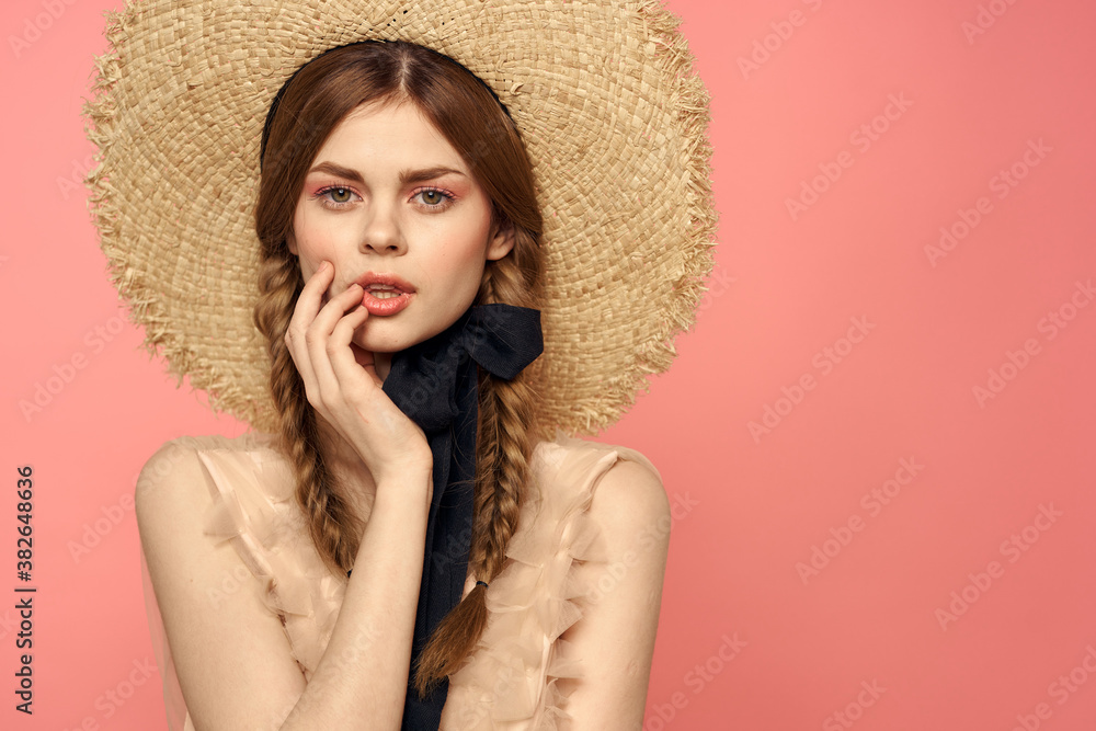 Romantic girl with pigtails and in a straw hat smile romance pink background Copy Space Romantic girl with pigtails and in a straw hat smile romance pink background Copy Space