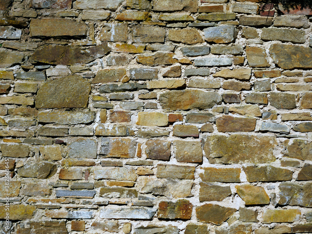 Obraz premium Stary kamienny mur ze średniowiecznego zamku jako tło