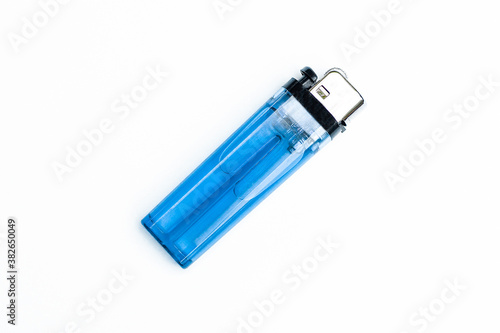 Blue plastic lighters on white background top view.