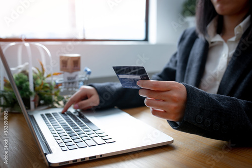 Close up of Business Woman Hand using credit card for work in the office room  business home workSME shopping online marketing  freelance concept.