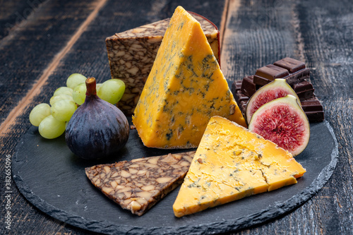 British and Irish cheeses, tasting plate with blue shropshire, brown porter cheese and smoked cheddar