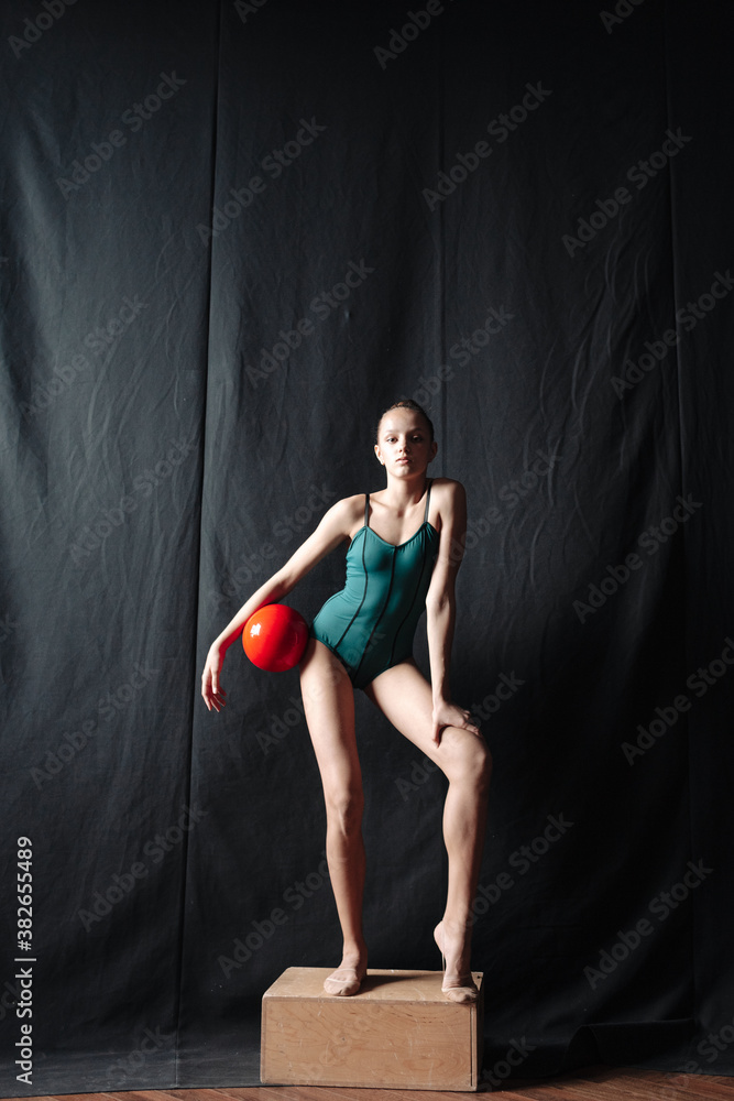 Young gymnast girl stretching and training