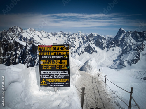 Attetion sign label in Vallee Blanche, Chamonix, France in summer