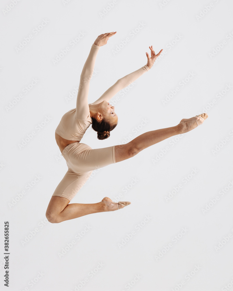 Young gymnast girl stretching and training