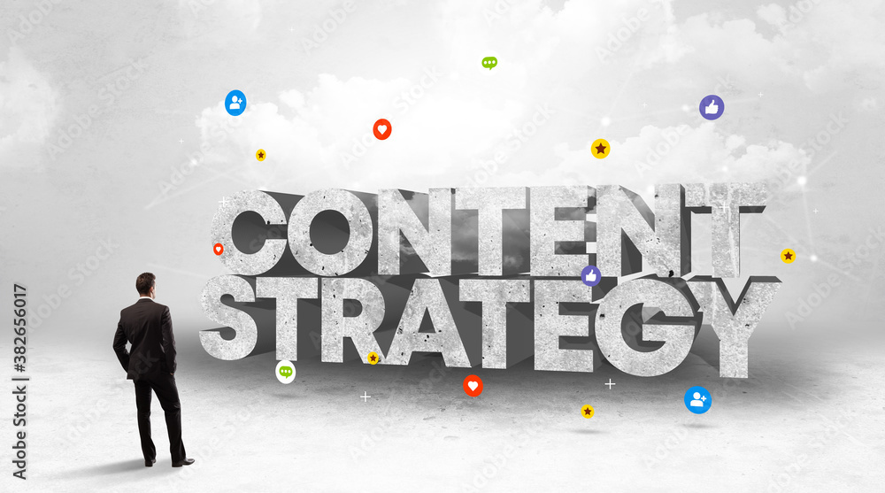 Young businessman standing in front of CONTENT STRATEGY inscription, social media concept Young businessman standing in front of CONTENT STRATEGY inscription, social media concept