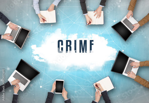 Group of people having a meeting with CRIME insciption, web security concept
