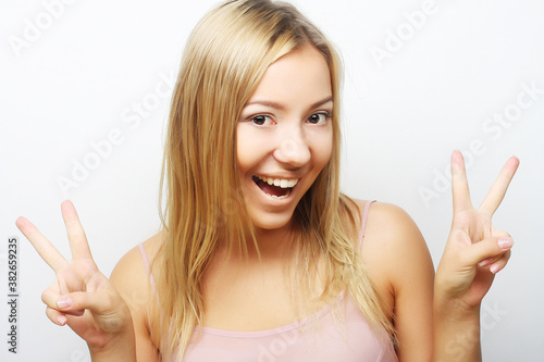 Successful girl gives thumb up with two hands