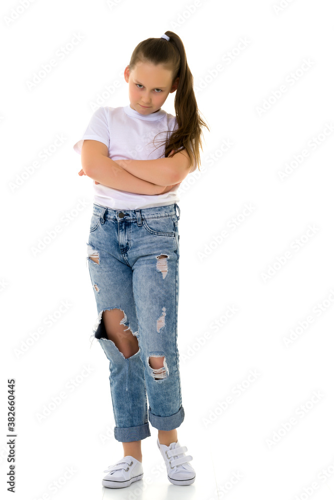 Obraz premium Little girl in a pure white T-shirt for advertising and jeans.