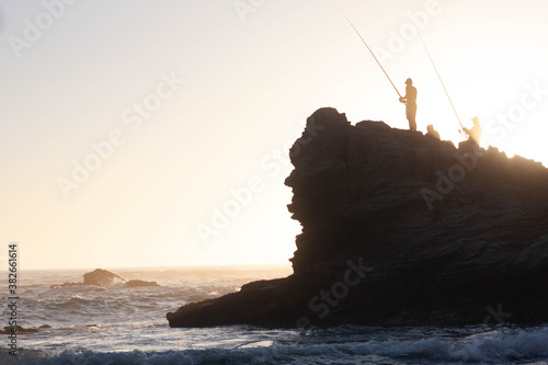 Fisherman on a ledge