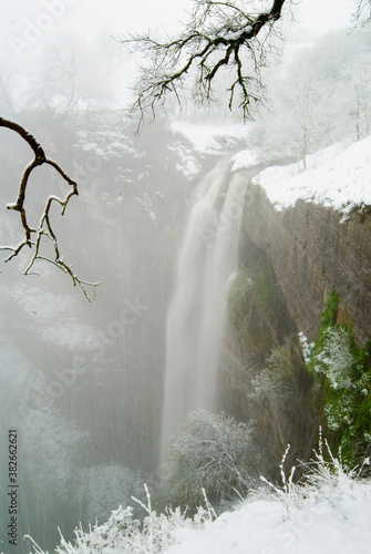 Gujuli waterfall with snow, Araba, Basque Country, Spain photo