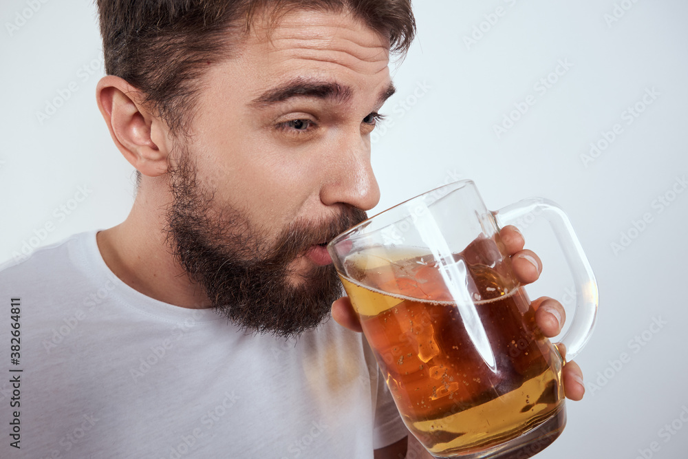 emotional man with a large mug of beer alcoholic drink gesturing with his hands drunken state emotional man with a large mug of beer alcoholic drink gesturing with his hands drunken state