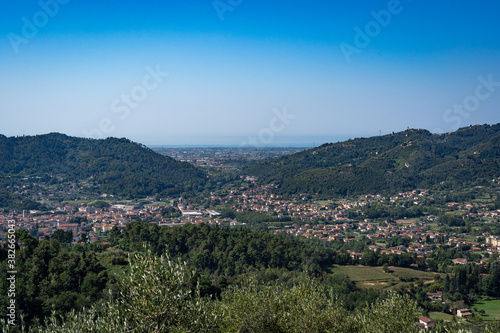 Italian landscape view from Montecastrese, Camaiore to Viareggio, with mountains blue sky and sea