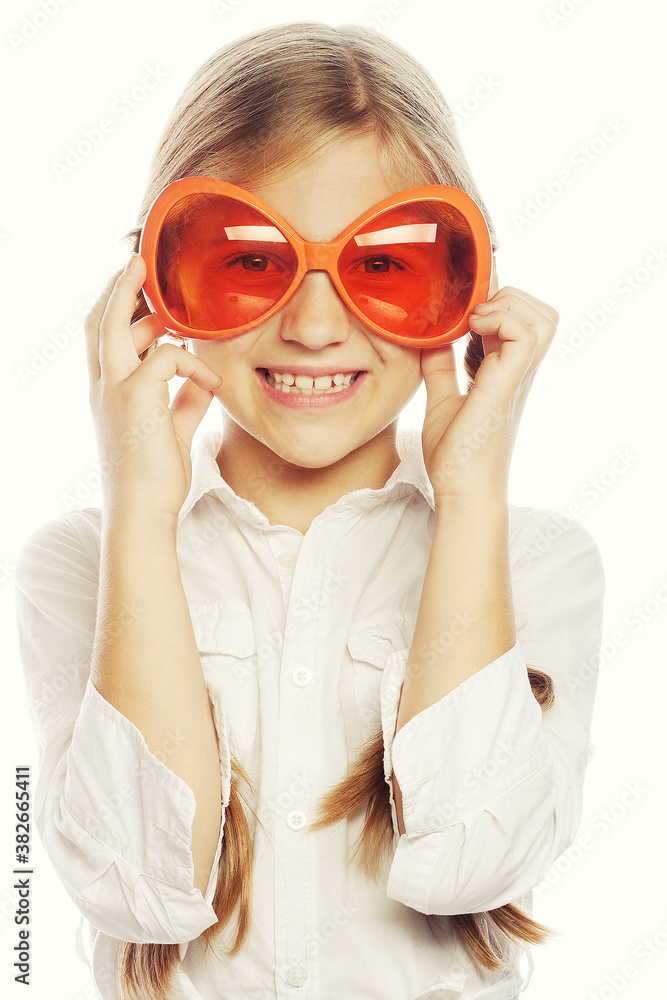 happy little girl with fun orange carnaval glasses happy little girl with fun orange carnaval glasses