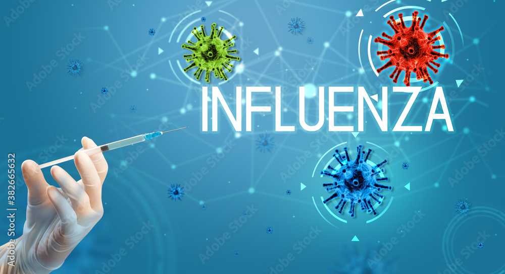 Syringe, medical injection in hand with INFLUENZA inscription, coronavirus vaccine concept Syringe, medical injection in hand with INFLUENZA inscription, coronavirus vaccine concept