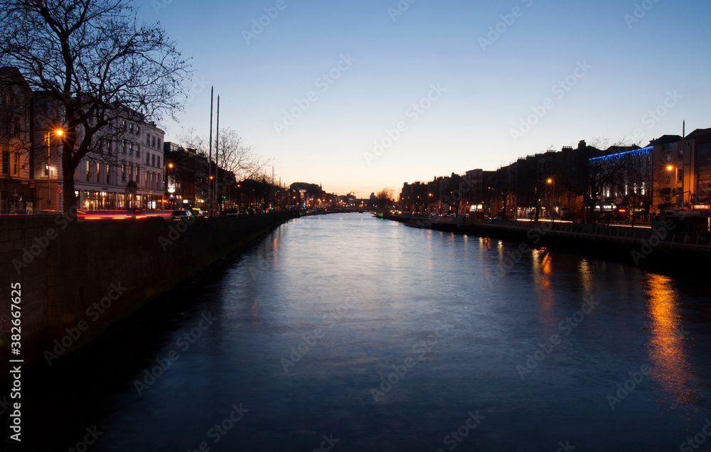 City Center with business quarter at the late sunset time on the river Liffey