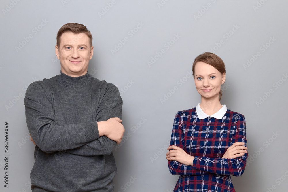 Portrait of happy joyful man and woman standing together and smiling Portrait of happy joyful man and woman standing together and smiling