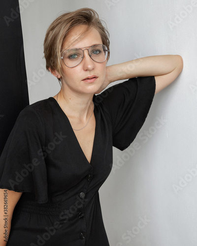Girl in a black dress and glasses