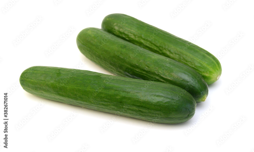 Cucumber and slices isolated over white background. Cucumber and slices isolated over white background.