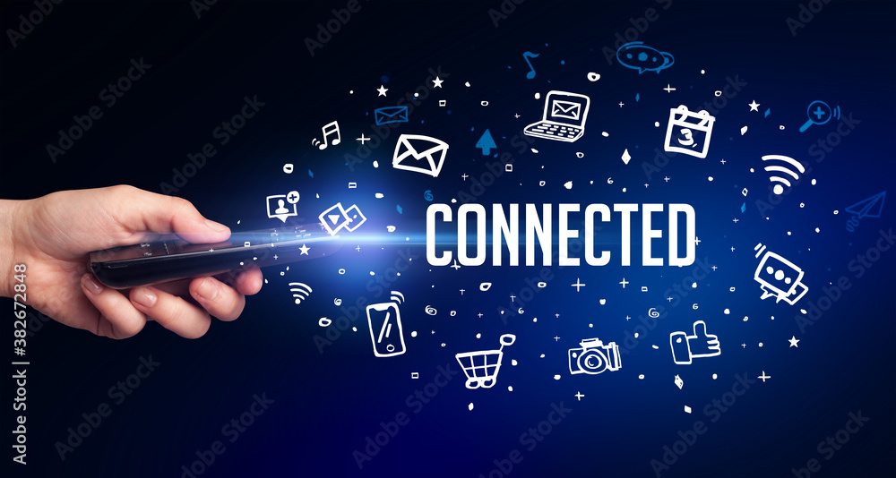 hand holding wireless peripheral with CONNECTED inscription, social media concept hand holding wireless peripheral with CONNECTED inscription, social media concept
