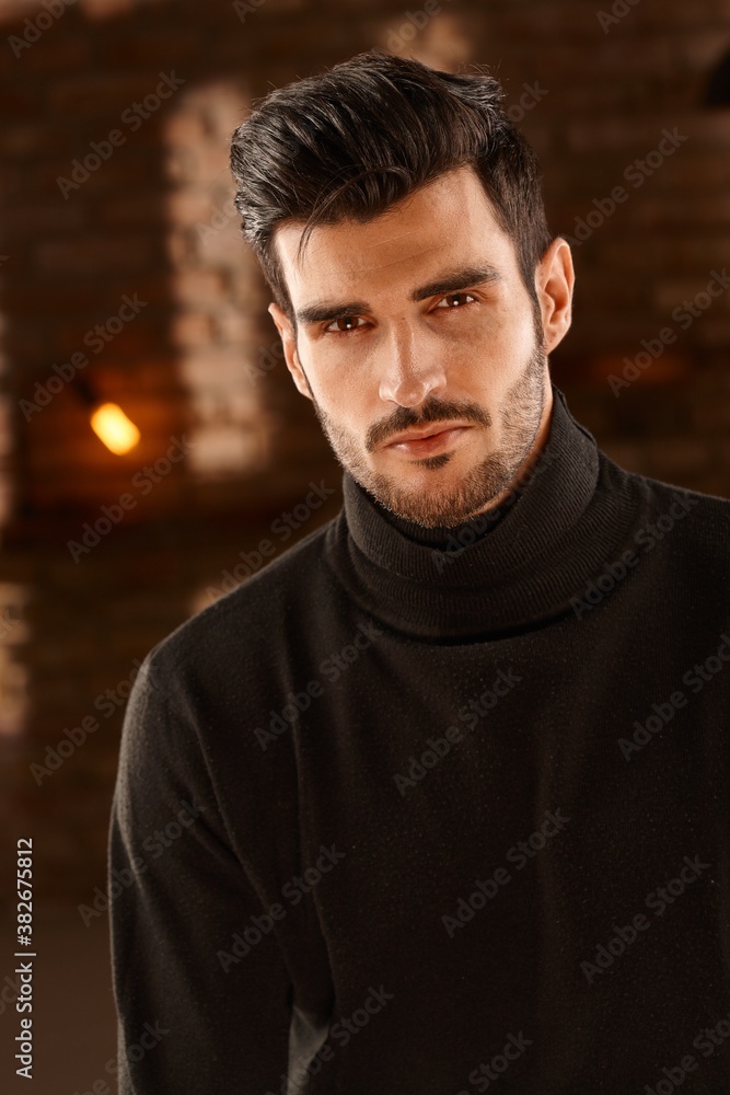 Portrait of handsome young man with trendy hair style, looking at camera. Portrait of handsome young man with trendy hair style, looking at camera.