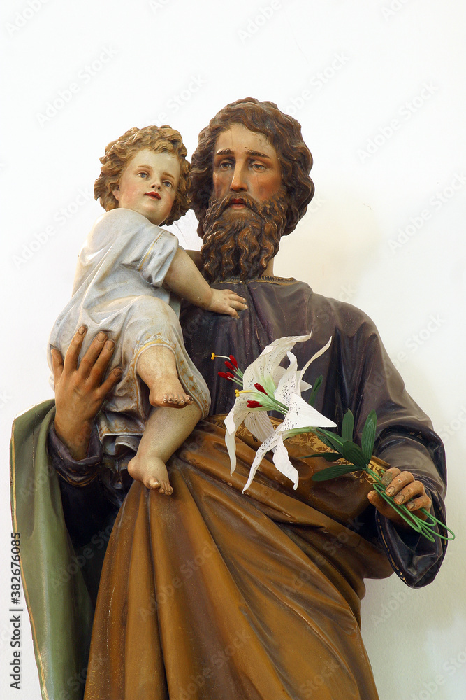 Fototapeta premium St. Joseph holds baby Jesus, statue in the parish church of St. Michael the Archangel in Mihovljan, Croatia