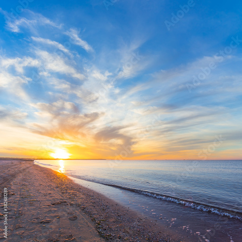 sandy sea beach at the sunset, outdoor summer vacation natural background