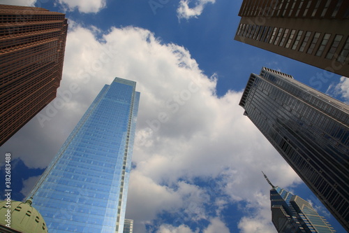 Bottom up view of Philadelphia skyscraper and reflection in glass in downtown Philadelphia  Pennsylvania  USA 