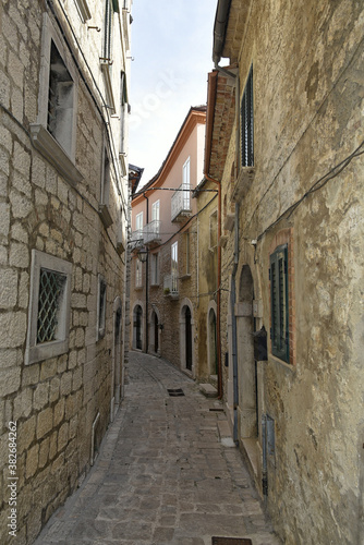 A narrow street among the old houses of Ferrazzano, a medieval village in the Molise region. 