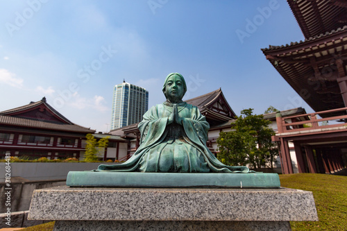 Priestess Statue At Zojoji Temple in Tokyo Japan. A Priestess Statue situated in front of the main hall of Zojoji Temple photo