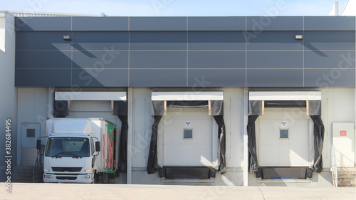 Three refrigerated truck loading docks of a modern food manufacturing facility. Western Sydney Australia