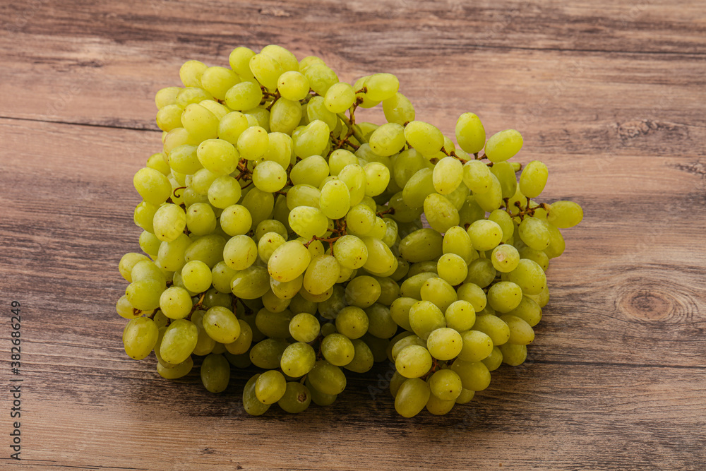 Green grape branch over background Green grape branch over background
