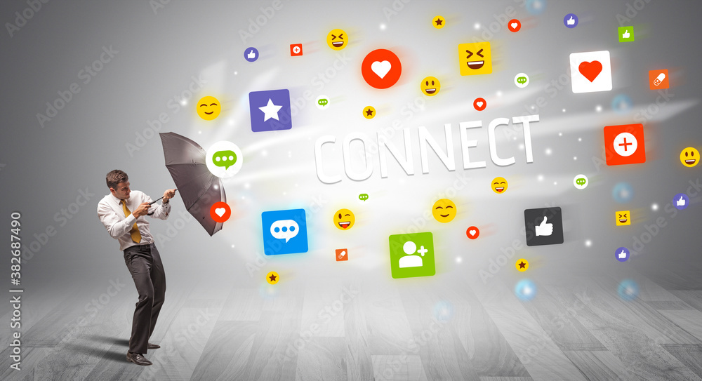 Handsome businessman defending with umbrella from CONNECT inscription, social networking concept Handsome businessman defending with umbrella from CONNECT inscription, social networking concept