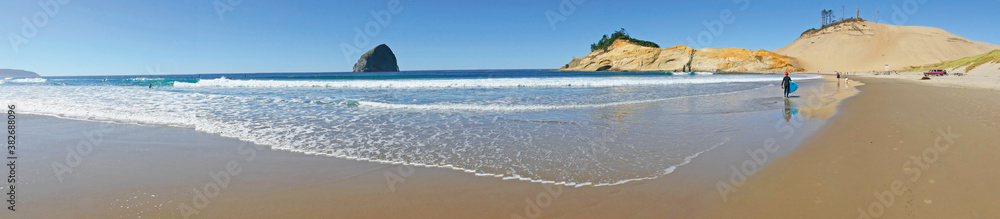 Pacific City Beach Panorama of the beach, headland and Haystack Rock standing 327 ft high. _ Oregon Coast
