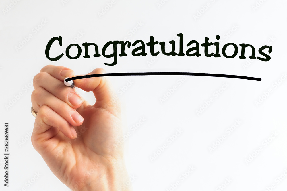 Hand writing inscription CONGRATULATIONS with marker, concept Hand writing inscription CONGRATULATIONS with marker, concept