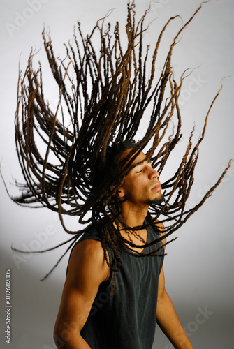 Valokuva Young black man throwing dreadlocks in the air