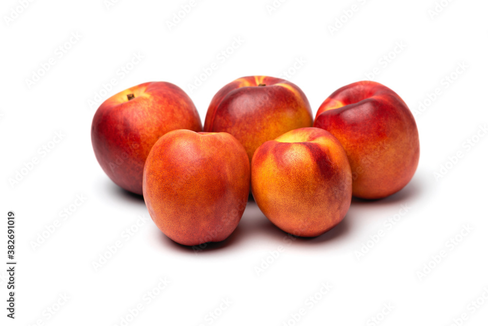 fresh juicy nectarines on a white background