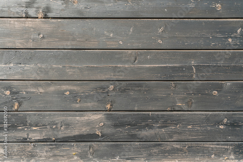 Old vintage background wood planks covered with black paint