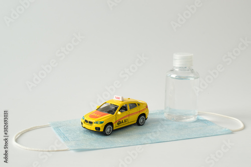 Kirov, Russia - 12 September 2020 There is a miniature taxi and antiseptic. Delivery and transportation photo