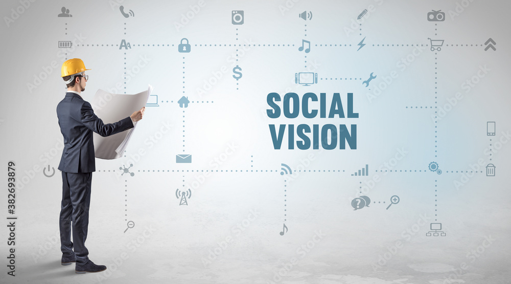 Engineer working on a new social media platform with SOCIAL VISION inscription concept Engineer working on a new social media platform with SOCIAL VISION inscription concept