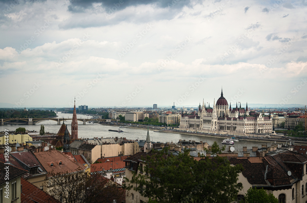 Budapest city skyline with the Hungarian Parliament and Danube River on a cloudy day, Budapest, Hungary