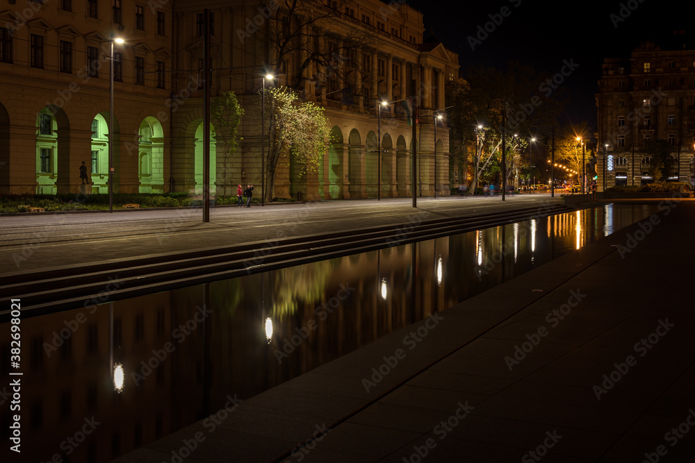 A pond reflects the street lights in Kossuth Lajos square, Budapest, Hungary