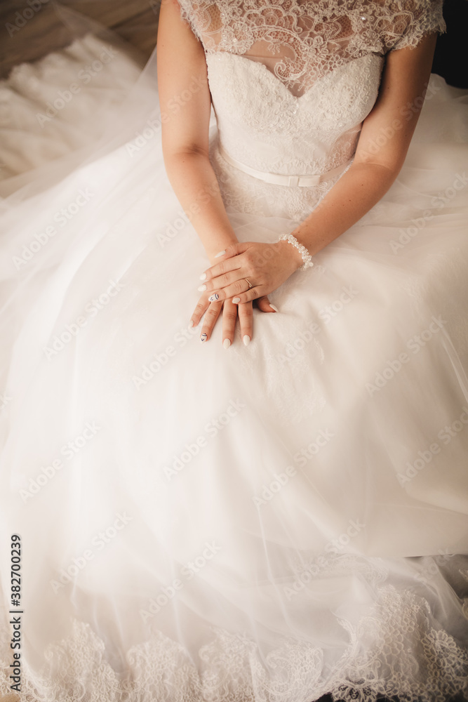 Bride hand on wedding dress. selective focus. wedding day Bride hand on wedding dress. selective focus. wedding day