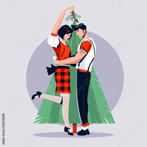 Love Couple Kissing Under The Mistletoe during Christmas Holidays Celebrate
